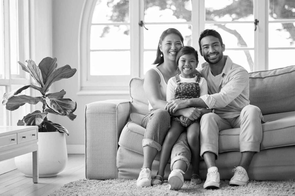 greyscale photo of family in home
